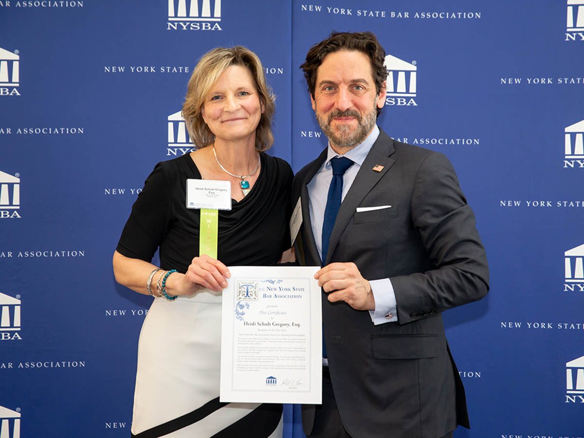 2024 New York State Bar Association Attorney Professionalism Award Winner Heidi Schult Gregory (left) with Jean-Claude Mazzola, chair of the Committee on Attorney Professionalism at the Bar Center in Albany, N.Y. on May 1, 2024.