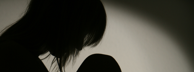 Graphic of depressed woman in black and white.