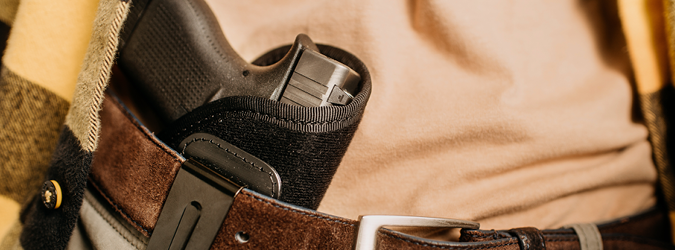 Image of a person wearing a gun in a holster