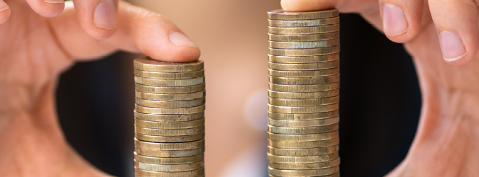 Picture of hands holding a stack of coins.