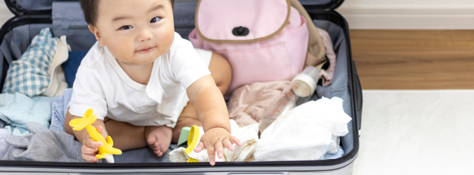 Baby holding a toy.