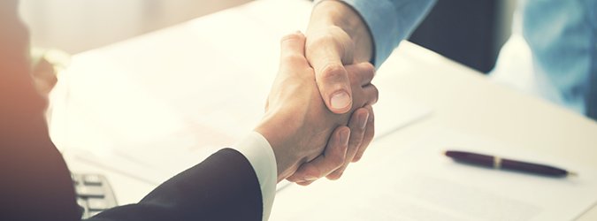business people handshake after partnership contract signing