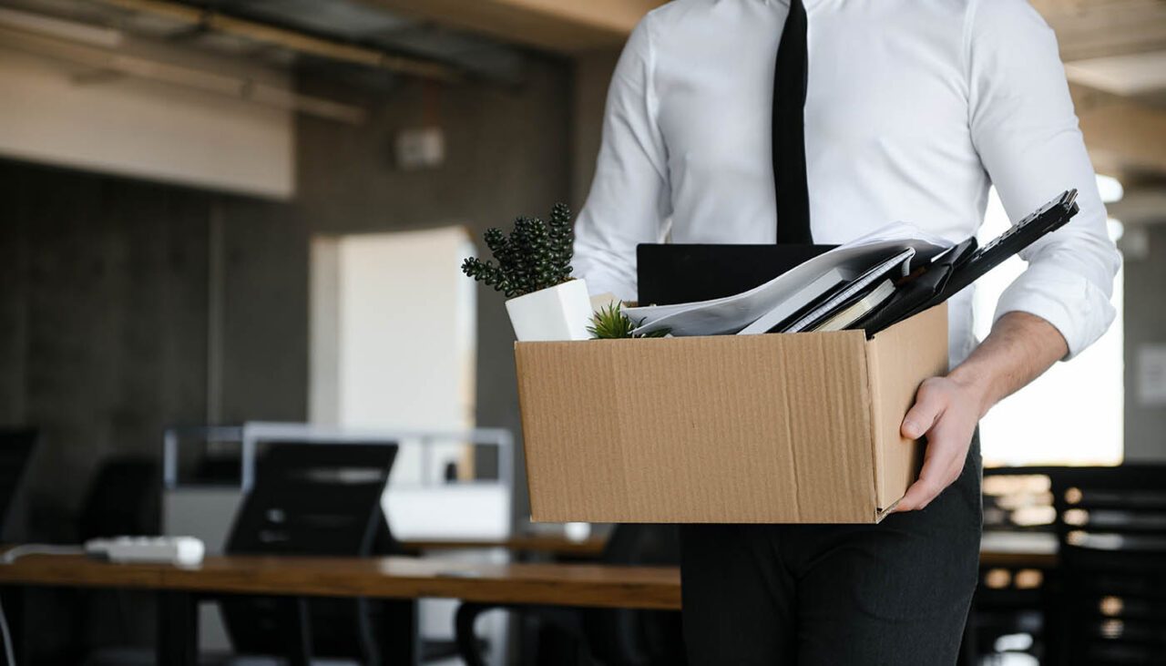 Sad,Fired.,Let,Go,Office,Worker,Packs,His,Belongings,Into