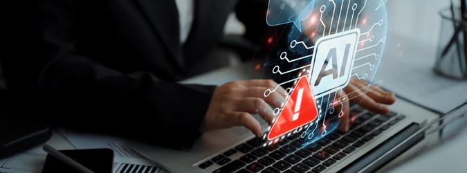 Person typing on a laptop with digital graphics showing an AI symbol and a red warning triangle, suggesting caution or alert related to artificial intelligence.