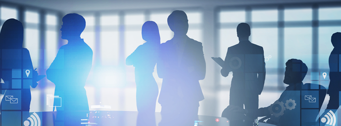 Silhouettes of professional people standing and sitting in an office, overlaid with digital icons for communication and data.